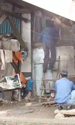 House under Bandra station staircase